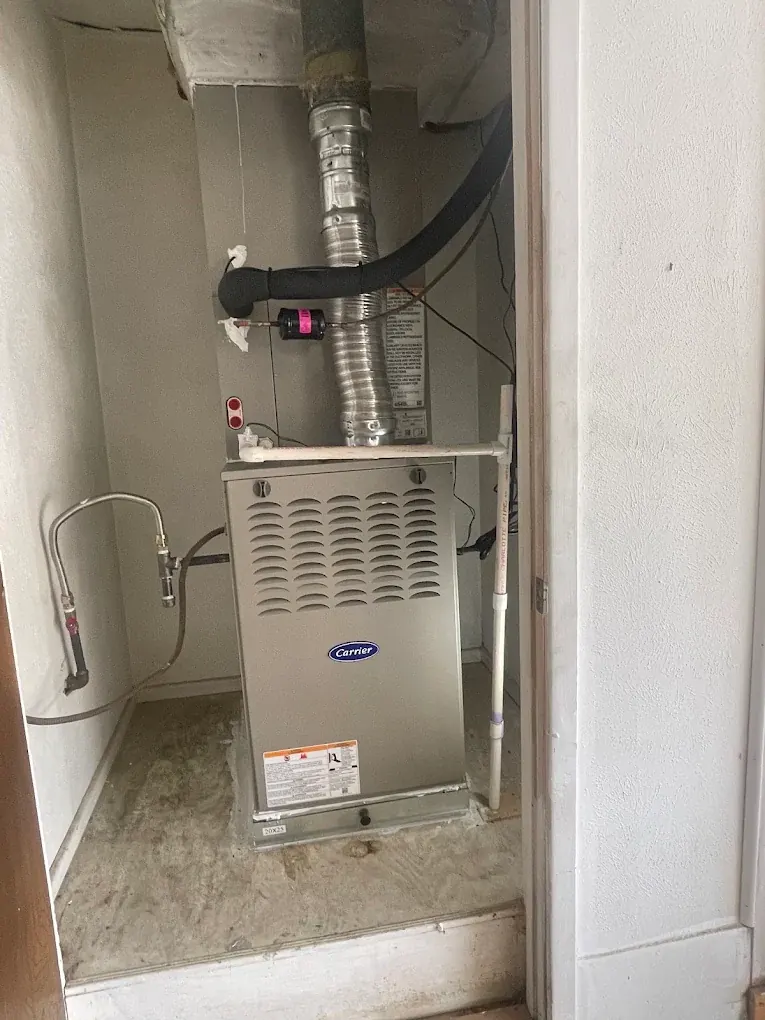 Indoor furnace installation completed by Tito's Heating and Air
