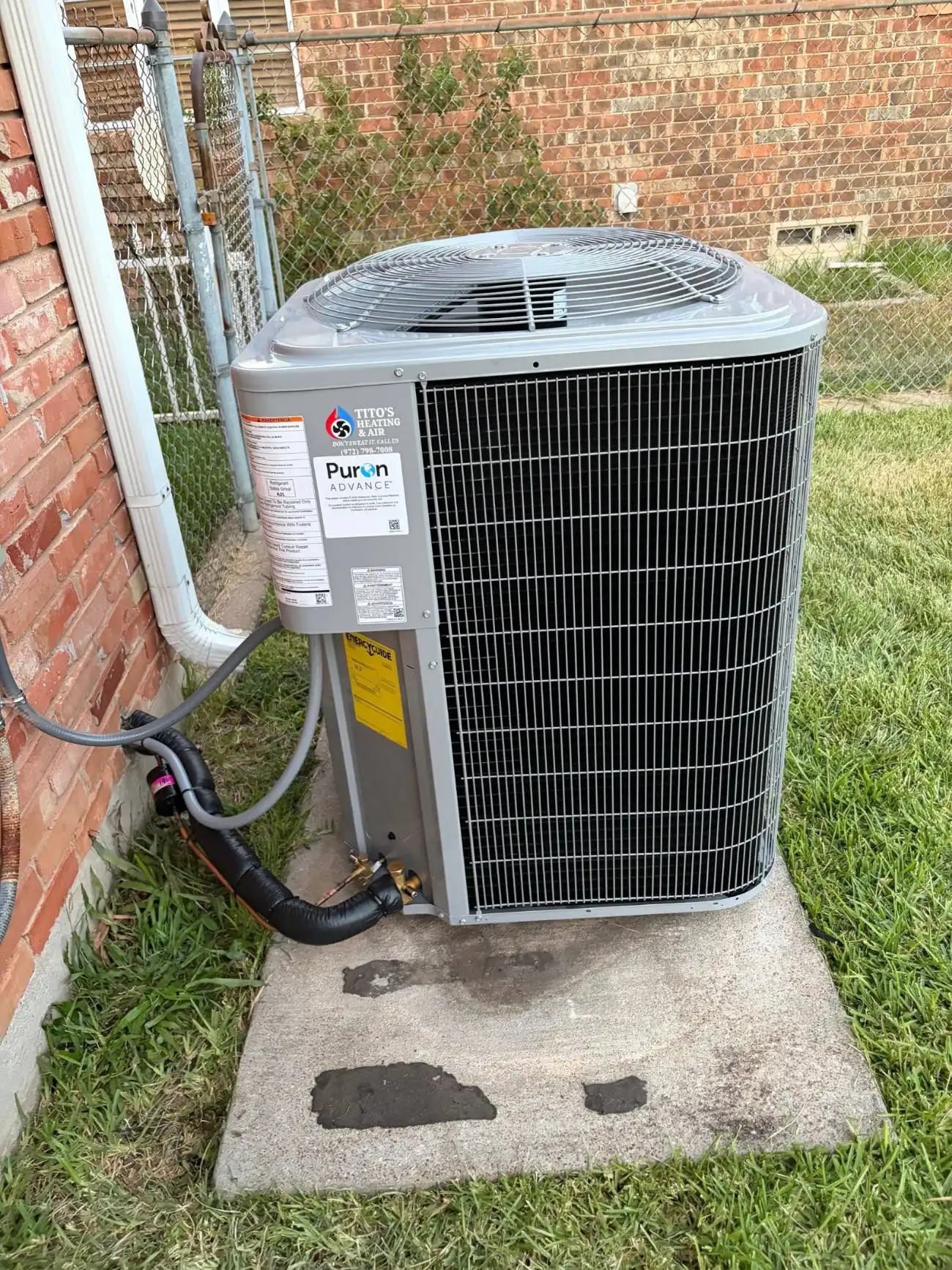 Tito's Heating and Air branded Carrier condenser installed at a Forney home